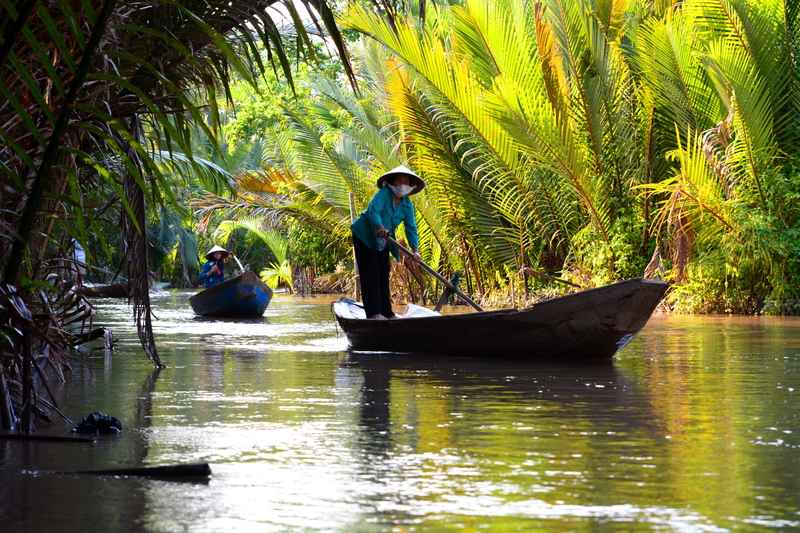 Wooden boats on Mekong Delta river in southern Vietnam